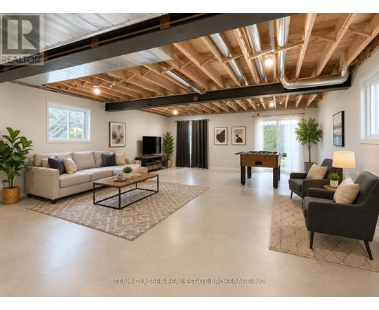A spacious living room with a high ceiling and wooden beams.