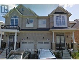 A two-story house with a garage is for sale by Zolo Realty Brokerage.
