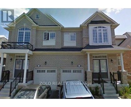 A two-story house with a garage is for sale by Zolo Realty Brokerage.