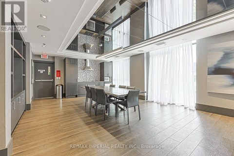 A dining room with a table set for four.