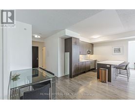 A modern kitchen with a glass table and chairs.