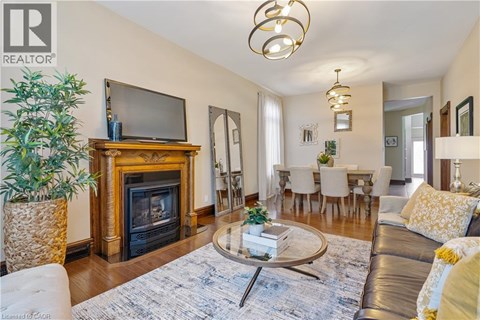 A living room with a fireplace and a television on top of it.