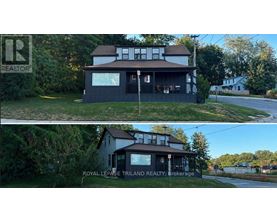 A house with a sign that says "REALTOR" in the top left corner.
