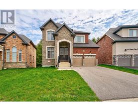A house with a driveway in front of it.