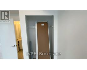 A room with a door and a sign that says "REALTOR".