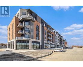 A modern apartment building with a car parked in front.