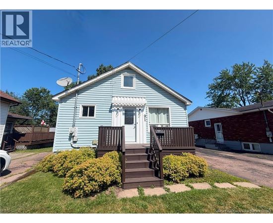 A blue house with a white door and a small porch.