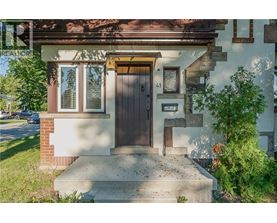 A house with a brown door and a small window above it.