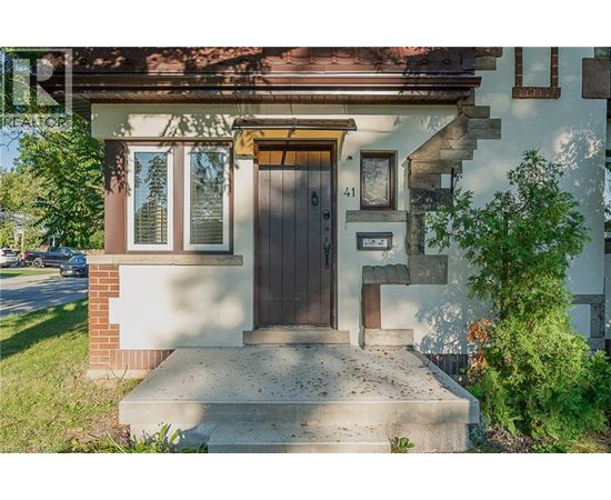 A house with a brown door and a small window above it.