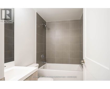A bathroom with a tub and a shower.