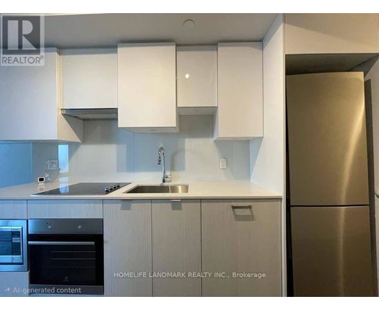 A modern kitchen with white cabinets and stainless steel appliances.