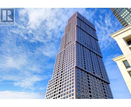 A tall building with a blue sky in the background.