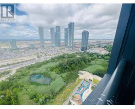 A bird's eye view of a city with a swimming pool in the foreground.
