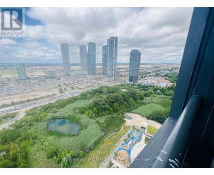 A bird's eye view of a city with a swimming pool in the foreground.