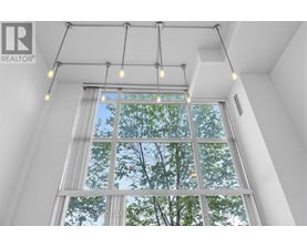 A window with a view of trees and sky.