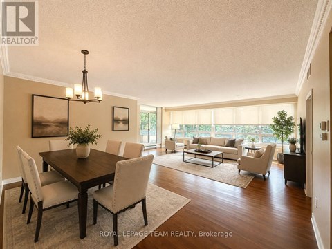 A well-lit dining room with a table set for six.