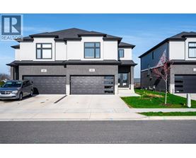 A modern two-story house with a garage is shown in the image.