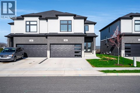 A modern two-story house with a garage is shown in the image.