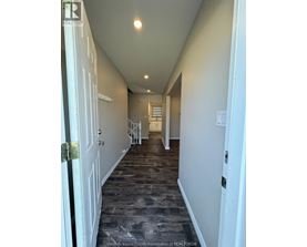 A long hallway with doors on both sides.