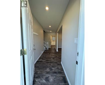 A long hallway with doors on both sides.