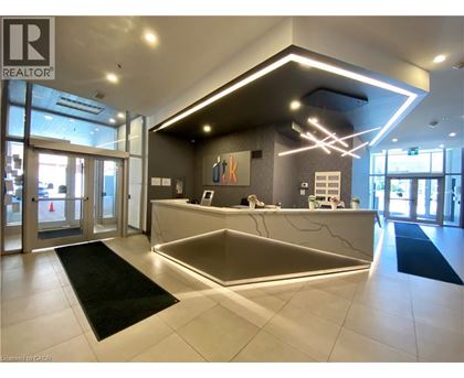 A reception area with a desk and a sign that says REALTOR.