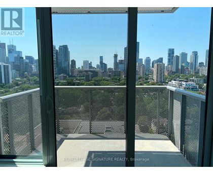 A balcony with a view of a city skyline.