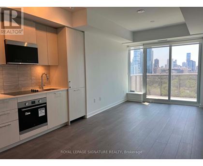 A kitchen with a microwave, oven, and cabinets.
