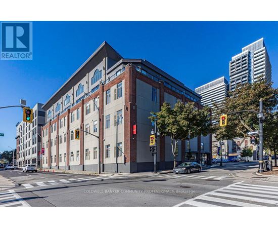 A street view of a building with a sign that reads "REALTOR" on it.