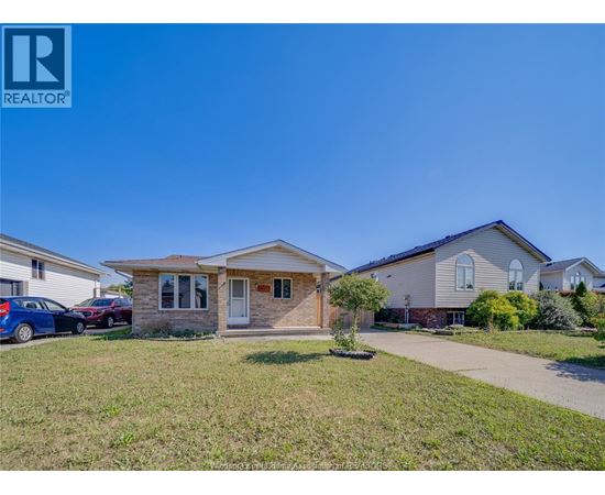 A house with a car parked in front is for sale.
