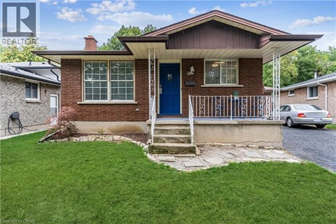 A house with a blue door and a small front yard.