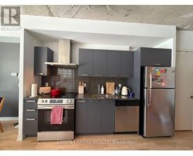 A modern kitchen with Union Capital Realty Brokerage logo.