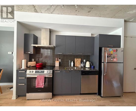 A modern kitchen with Union Capital Realty Brokerage logo.