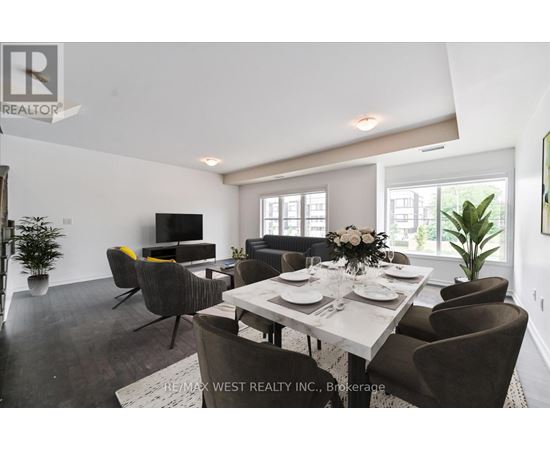 A dining room with a table set for six and a television.