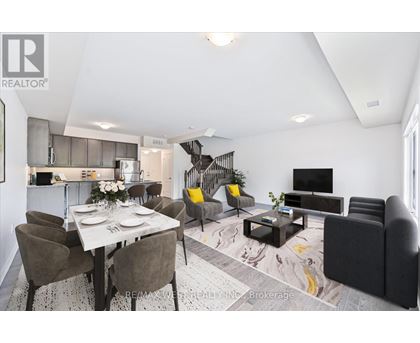 A modern living room with a dining table set for two.