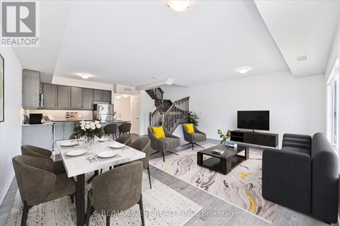 A modern living room with a dining table set for two.