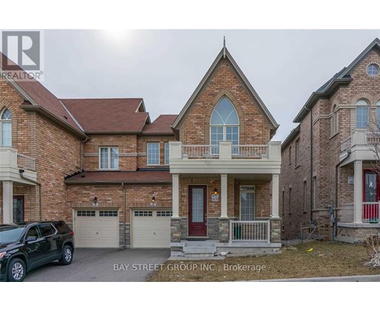 A house with a car parked in front of it.
