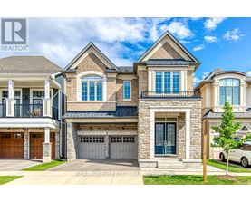 A large, multi-story house with a stone facade and a garage door.