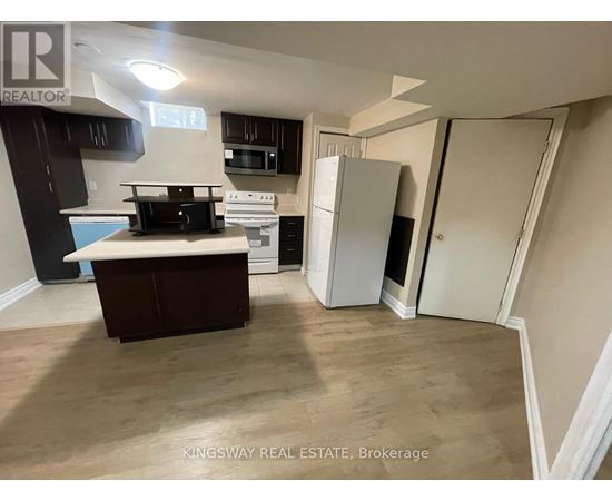 A kitchen with a white fridge and a white oven.