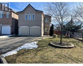 A house with a tree in front of it.