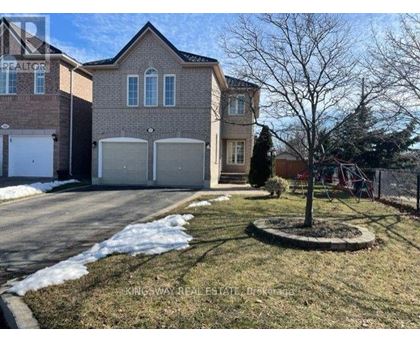 A house with a tree in front of it.