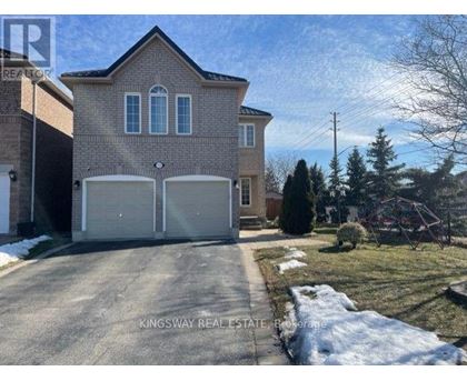 A house with a driveway in front of it.