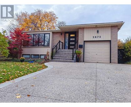 A house with the number 2673 on the garage door.
