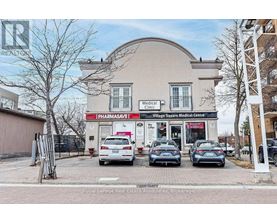 A medical clinic with a pharmacy is located in a commercial area.