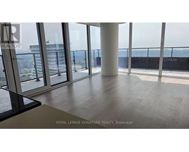 A room with a view of the cityscape from a high-rise building.