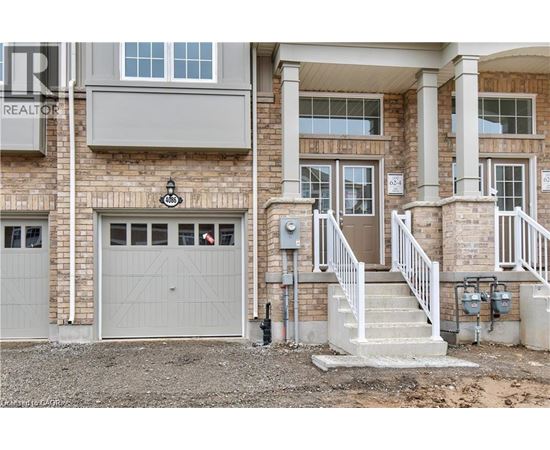 A house with a garage and a staircase leading to the entrance.