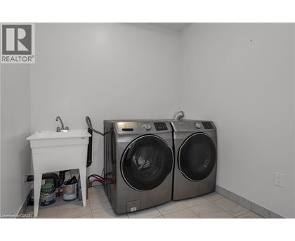 A laundry room with a washer and dryer.