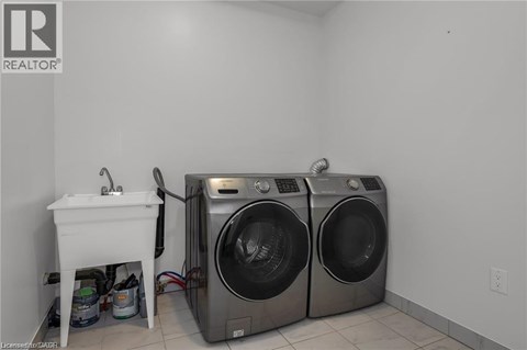 A laundry room with a washer and dryer.