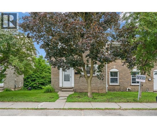A house with a tree in front and a sign that says "Reserved".