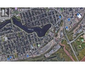 A satellite image of a city area with a lake, a McDonald's and a Tim Hortons.