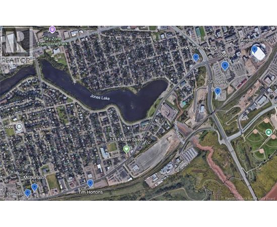 A satellite image of a city area with a lake, a McDonald's and a Tim Hortons.